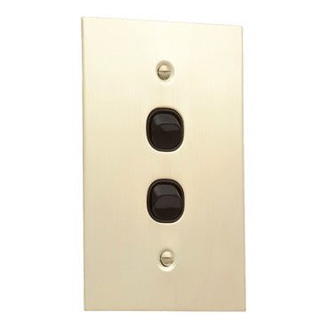 Clipsal brass switch with black insert
